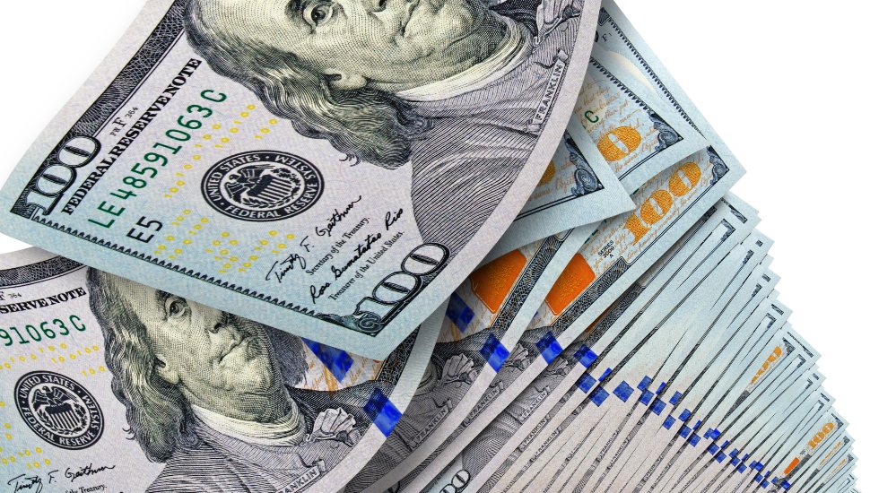 Very large stack of hundred-dollar bills on a white background.