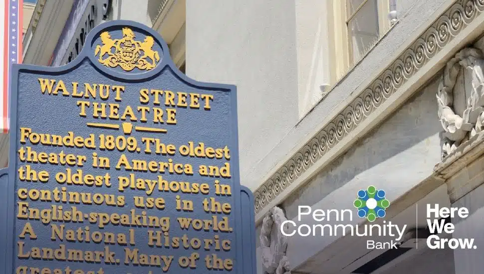 Historical marker for Walnut Street Theatre, America’s oldest continuously operating theatre, displayed beside the theatre’s exterior facade with Penn Community Bank branding overlay.