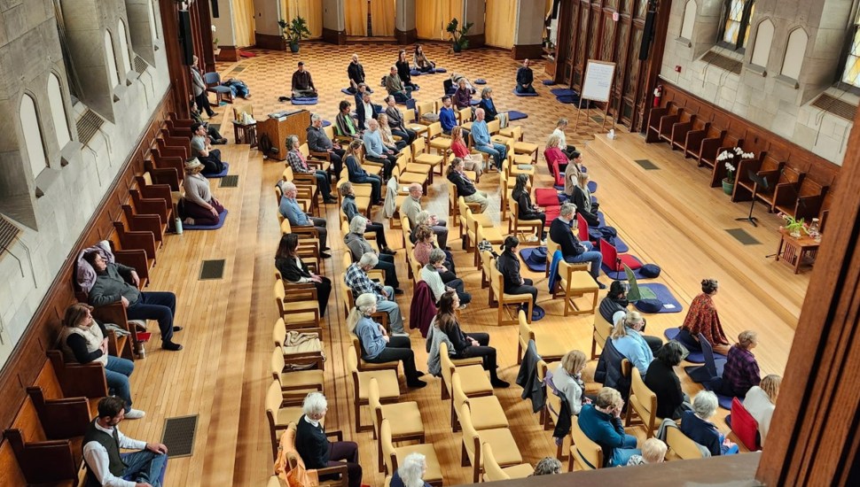 Aerial view of people sitting in silence.