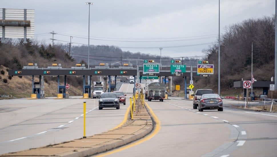 Cars driving through a Pennsylvania Toll Booth.