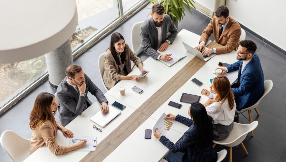 Employees working around a table.