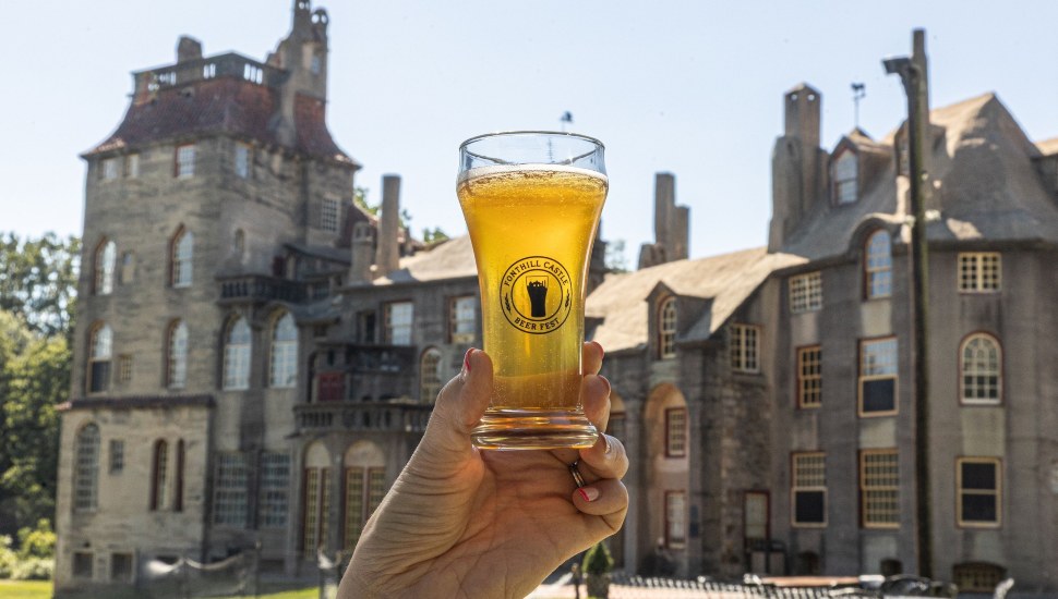 Glass of beer in front of Fonthill Castle.