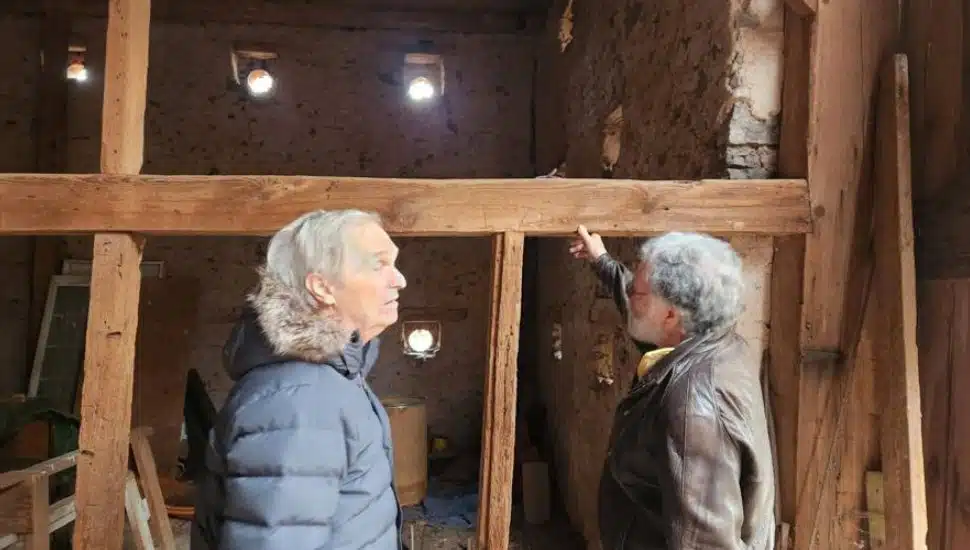 Greg Huber and Jeffrey Marshall inside Hoffman Barn.