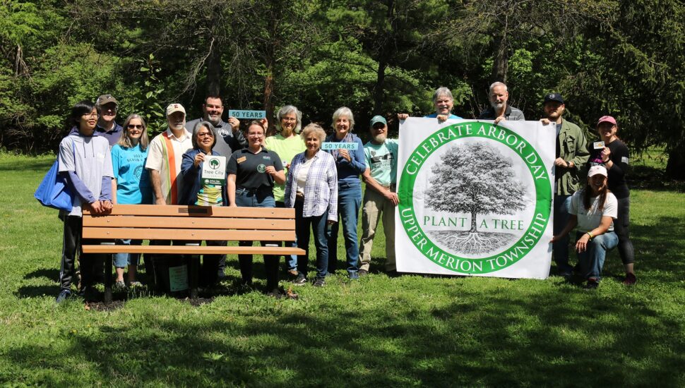 A group gathers at the General Recreation park bench celebrating Upper Merion's 50th year as a Tree City USA reward recipient and the nation's 250th anniversary.