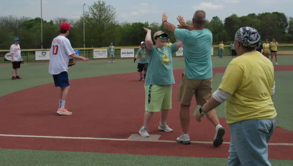 Kids and volunteers at AHA's Baseball Fun Day.