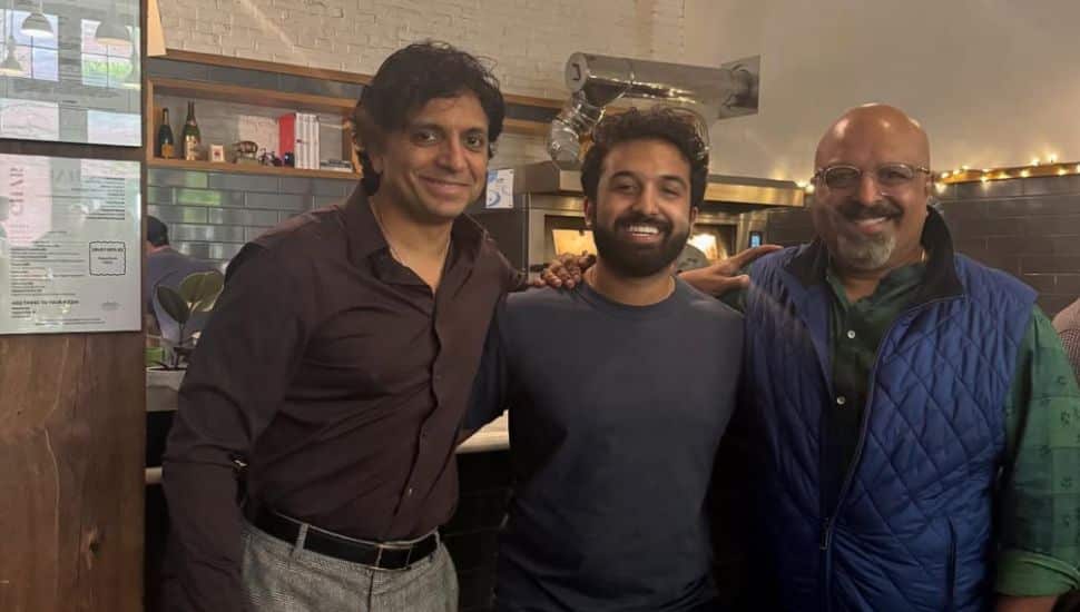 Filmmaker M. Night Shyamalan, at left, with CHAR owner Viraj Thomas and his father.