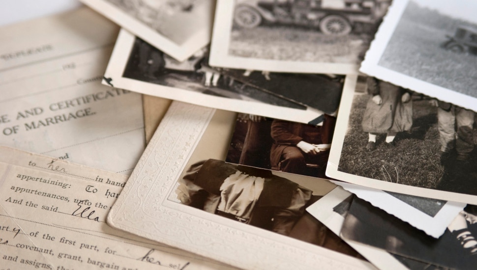 Genealogy family history theme with old family photos and documents.