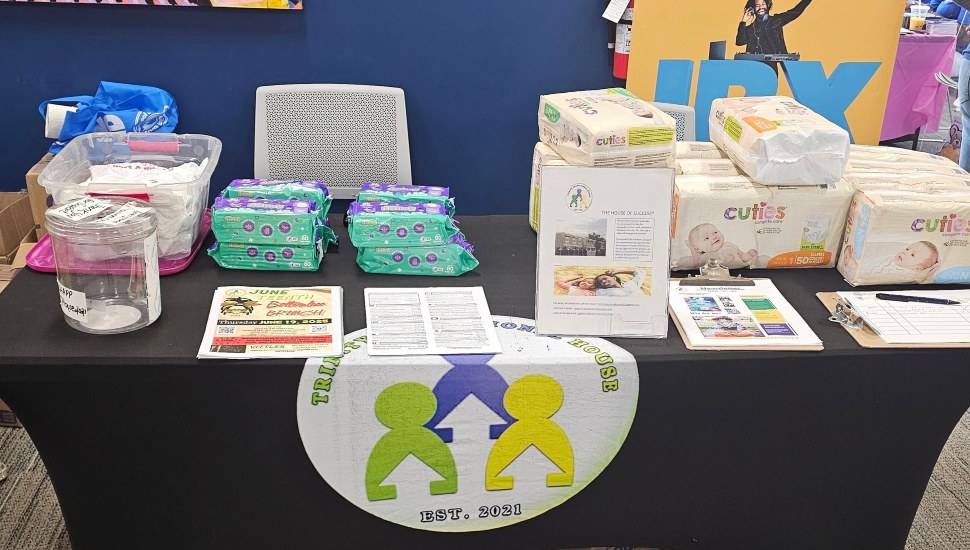 Trinity Transitional House Inc. had a table with some diaper products at the 2025 Keystone Center Block Party & Health Fair in October 2025.