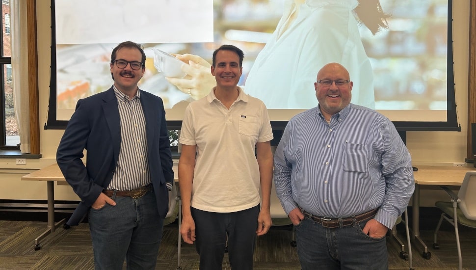 Group photo of three speakers in lecture series.