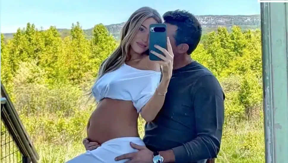 Alex Cooper and Matt Kaplan share the news of their first child together in this Instagram photo posted May 17.