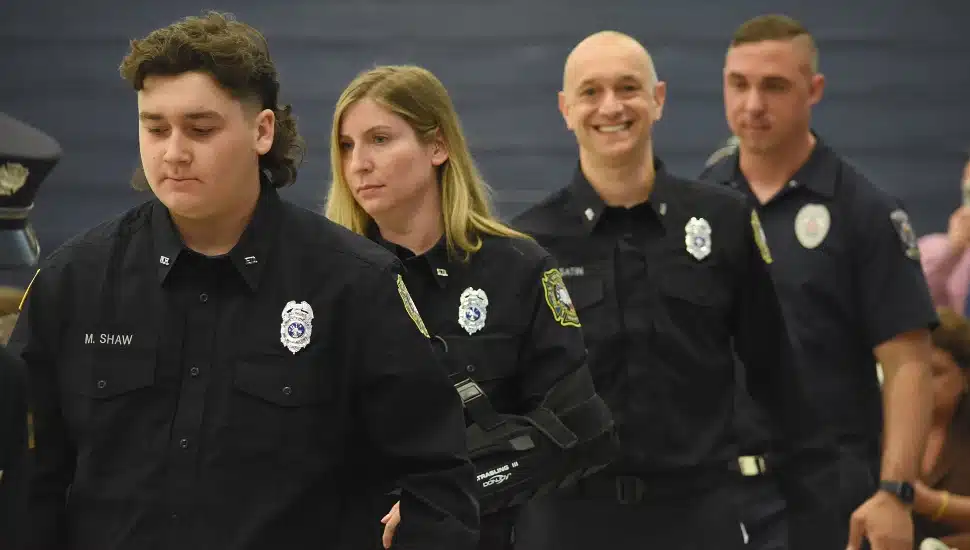 Volunteer firefighters (from left) Matthew Shaw, Tracy Topolin, Vladimir Usatin and Steven Whiskeyman process into the Newtown Campus Gymnasium on May 19 for the graduation ceremony of Bucks County Community College’s Department of Public Safety Training and Certification.