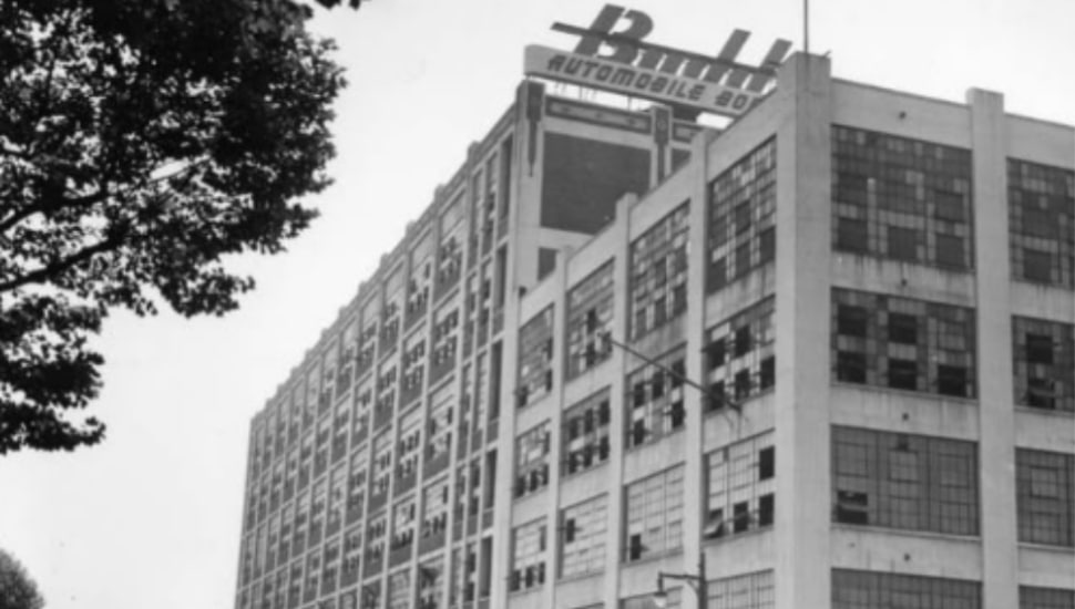Black-and-white photo of the former Budd Automobile Company plant in North Philadelphia showing the multi-story industrial building with the Budd signage visible at the top.