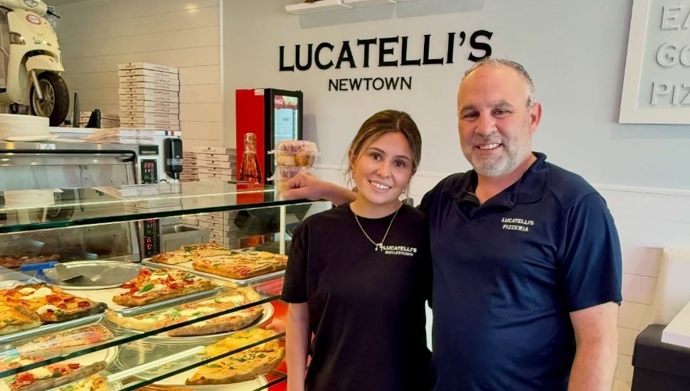 Lucatelli's Pizzeria owner Dave Schiano inside the new Newtown location, with fresh pies on display behind the counter.
