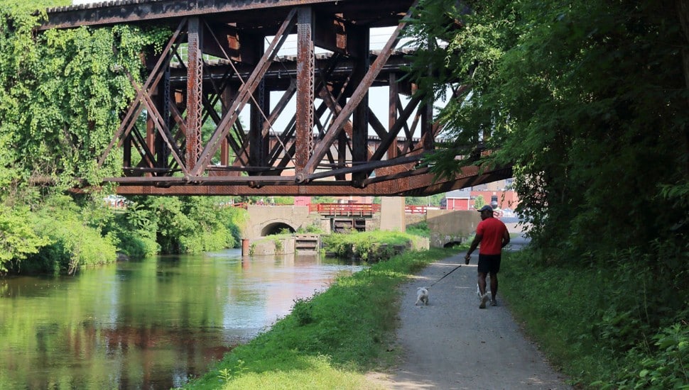 Man walking his dog along the Delaware Canal