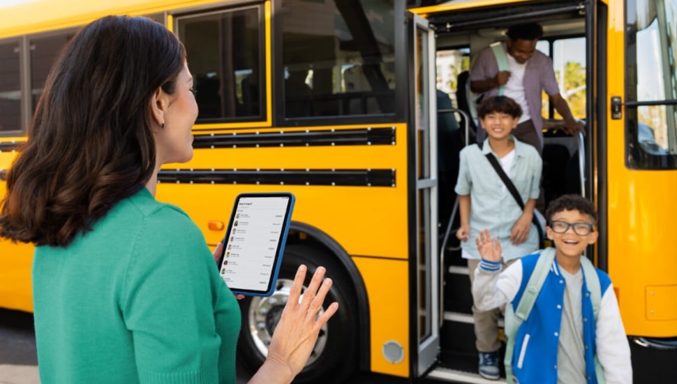 Parent using app for child coming off the school bus.
