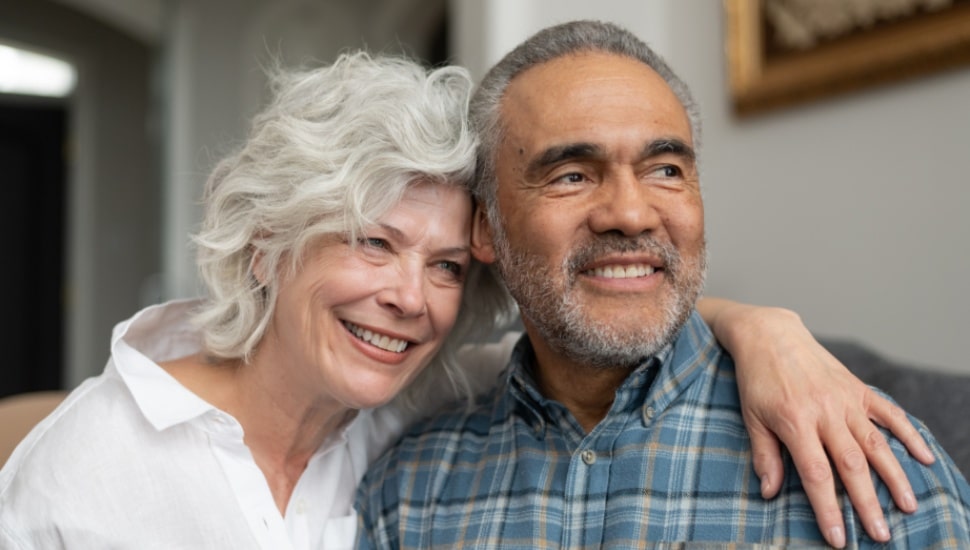 A senior couple is all smiles.