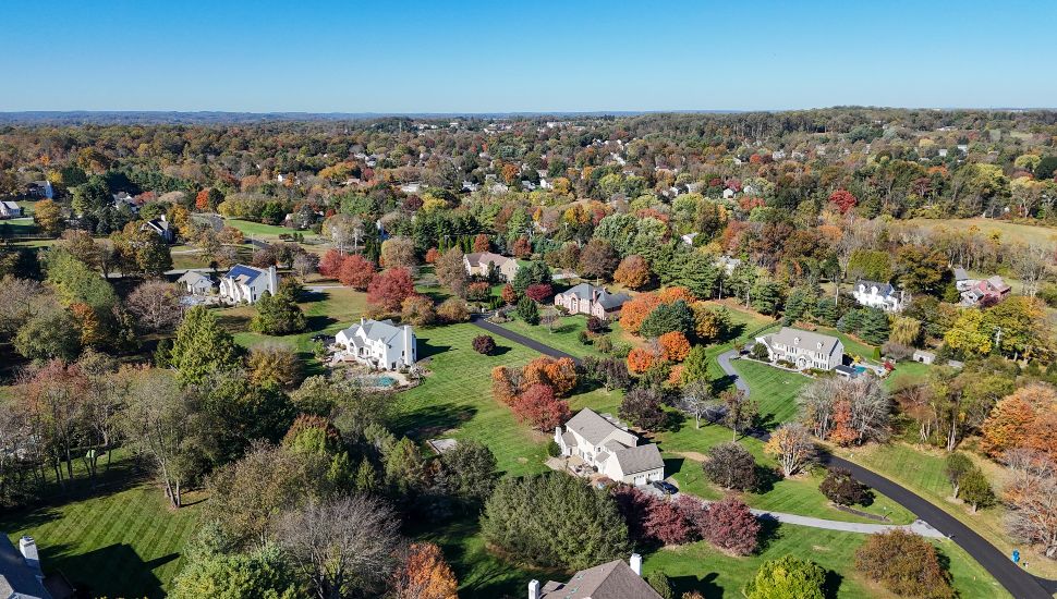 Aerial view of suburban West Chester homes in fall.
