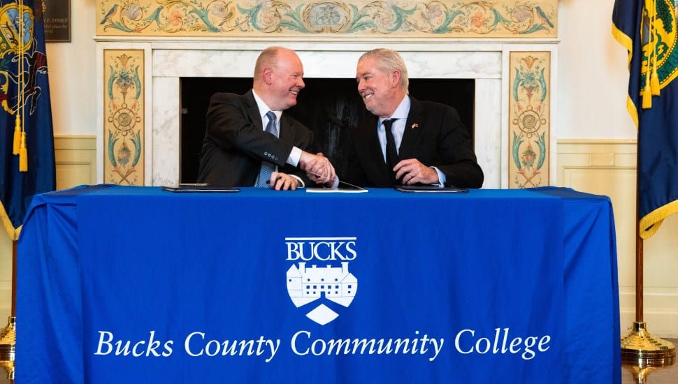 Temple University President John Fry (right) and Bucks County Community College President & CEO Patrick M. Jones, Ph.D., signed a new honors-to-honors agreement on June 25.