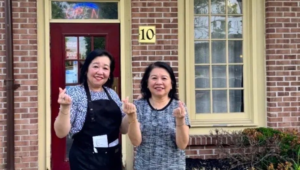 Cindy Tam and Marina Tam pose outside Ota-Ya Japanese Restaurant in Newtown, which will close its doors on July 3 after more than 30 years in business.