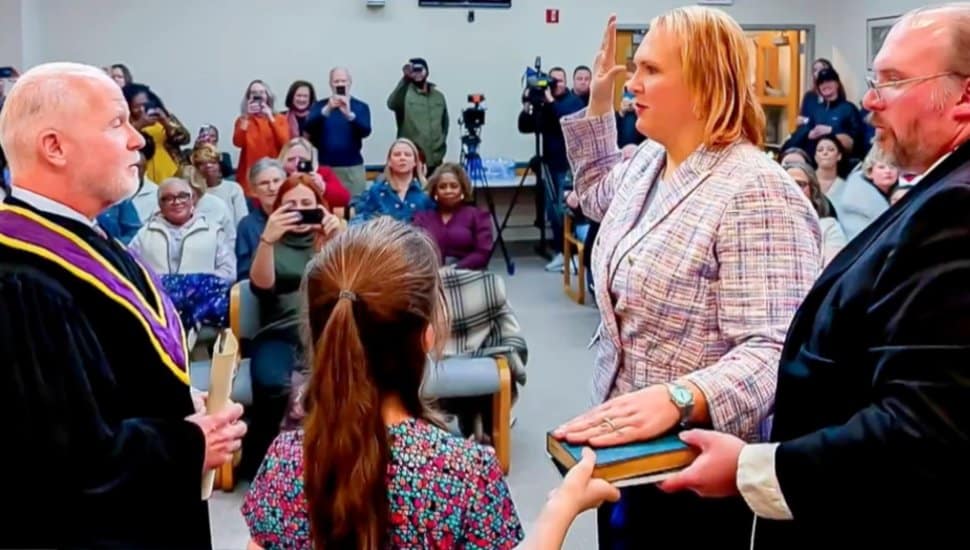 Erica Deuso raises her hand to swear in as Downingtown mayor.