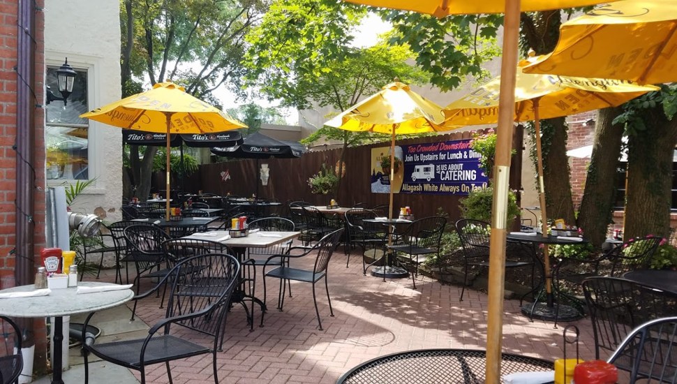 Outdoor seating at Penn Taproom, one of Doylestown's top destinations for an al fresco meal.